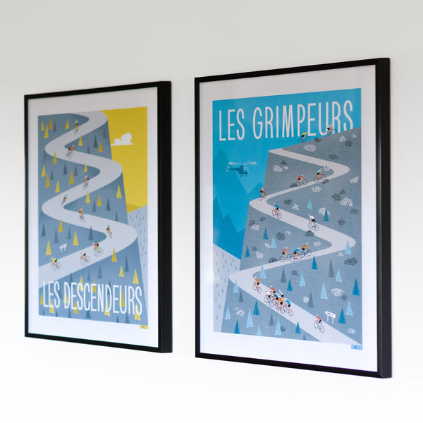 Climbers and Descenders cycling posters, wall mounted in black frames