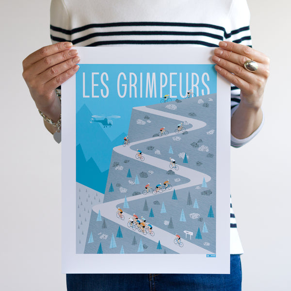 Woman holding 30 x 40cm Climbers cycling print