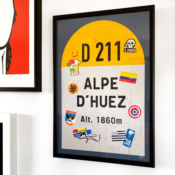 Alpe d'Huez personalised poster, french road sign, framed and displayed on a gallery wall with other prints