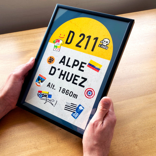 Alpe d'Huez personalised poster, french road sign, man holding framed print
