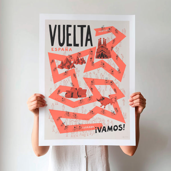 Person holding up an unframed Vuelta a Espana poster with illustrations of famous Spanish landmarks in orange and black typography.