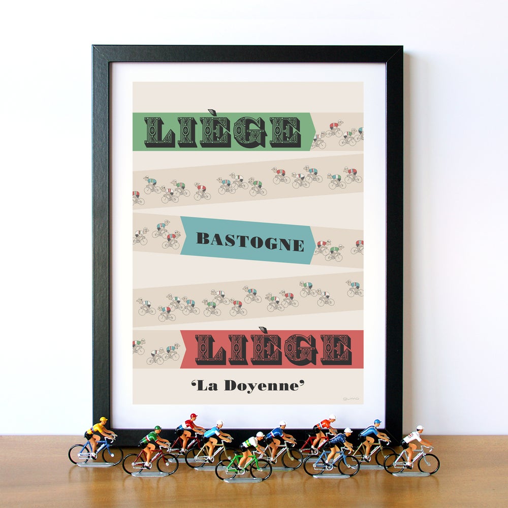 Liege Bastogne Liege cycling print in black frame, displayed with retro mini cycling figures